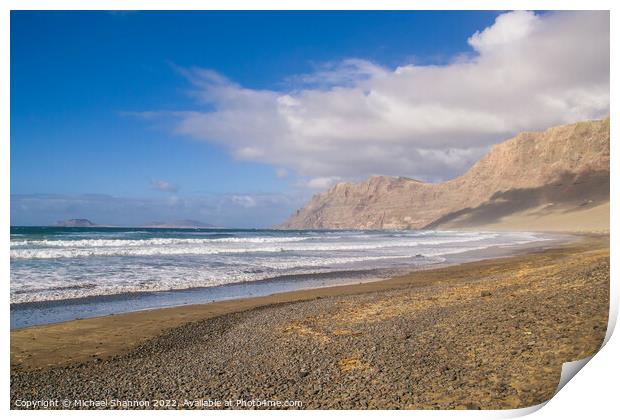 The beach and cliffs at Famara, Lanzarote Print by Michael Shannon