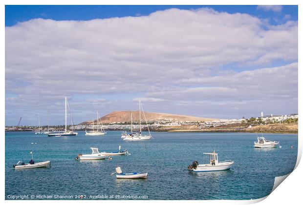 Small boats and Playa Blanca resort, Lanzarote Print by Michael Shannon