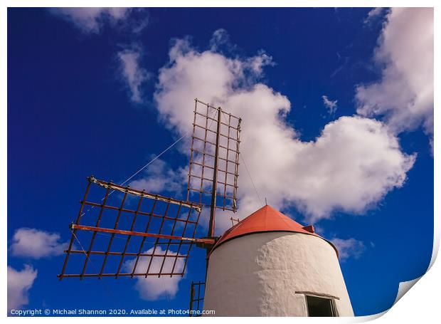 Windmill and sails on a sunny day in Lanzarote, Ca Print by Michael Shannon