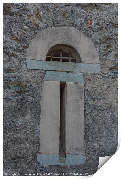 a slit  with security grating of an ancient castle Print by susanna mattioda