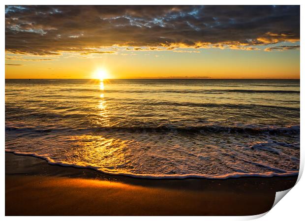 Photography with the sun between the sea and the clouds at a sunrise on the beach Print by Vicen Photo
