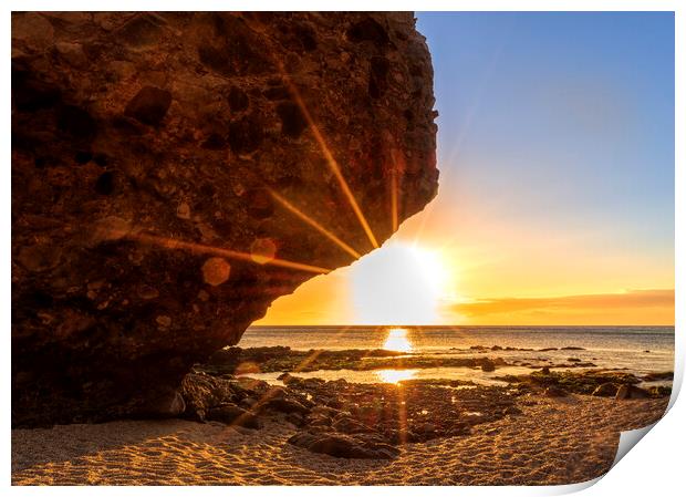 Photography with the sunrise sun behind the rock of the beach of the dead Print by Vicen Photo