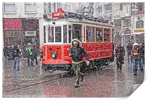 A nostalgic tram was passing by The Istiklal Street when snowfalls at Istanbul Print by Engin Sezer