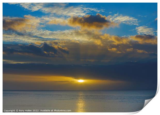 Sunset with a golden streak of sunlight going across the channel Print by Rory Hailes