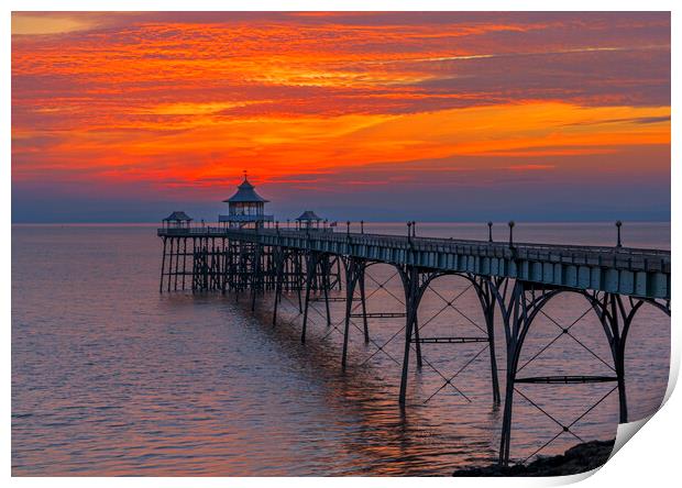 Clevedon Pier with brigh reddish orangey horizon Print by Rory Hailes