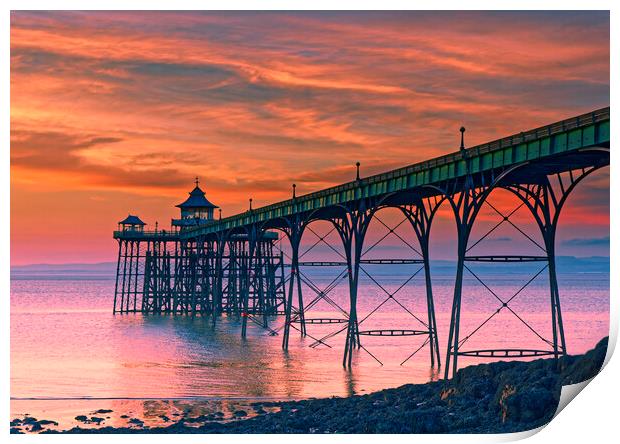 Clevedon Pier at sunset on a calm evening with cloud and blue sky above Print by Rory Hailes