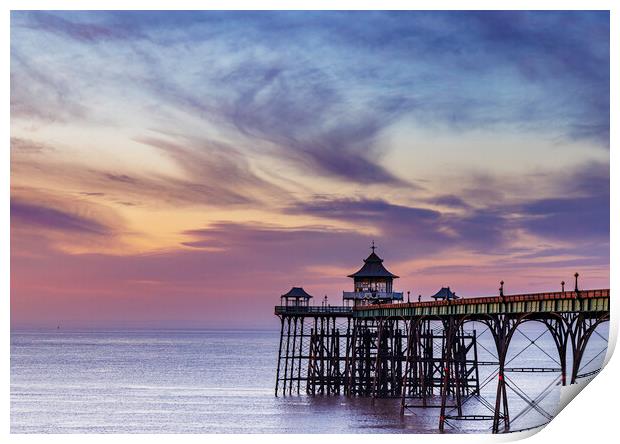 Clevedon Pier at sunset with a colourful sky and cirrus clouds catching the last of the sunlight Print by Rory Hailes