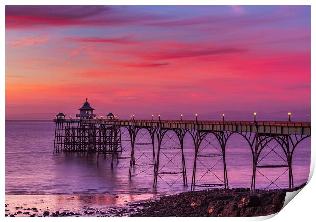 Clevedon Pier at sunset at low tide Print by Rory Hailes