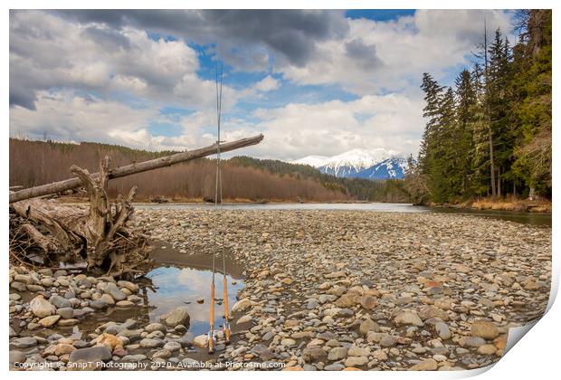 Two fly fishing rods on a dead tree on a river in British Columbia Print by SnapT Photography