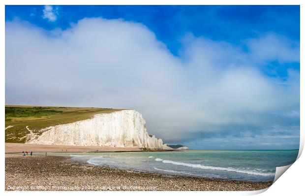 Dramatic white cliffs, blue sky and shingle beach  Print by SnapT Photography