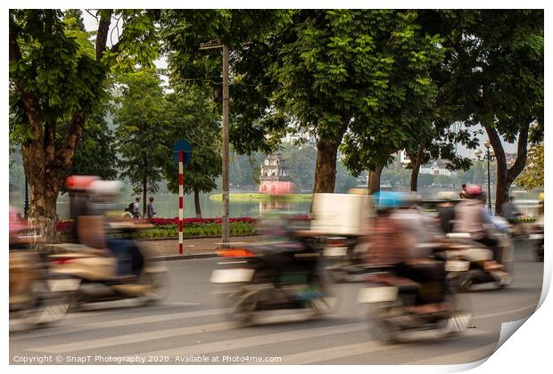 Motorbike motion at Hoan Kiem lake and turtle tower in the background Print by SnapT Photography