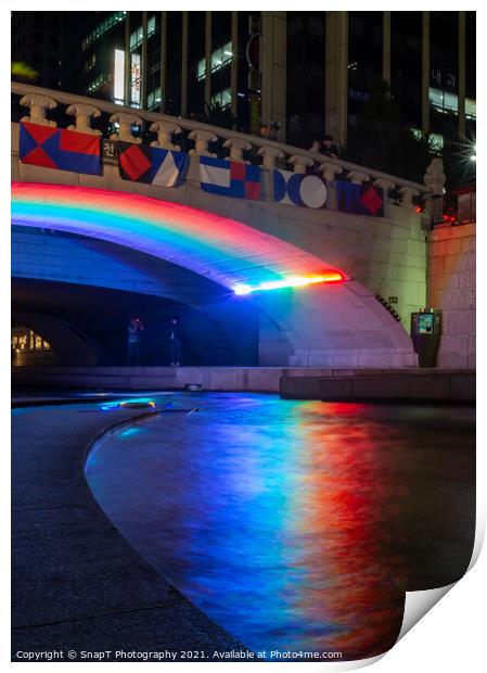 A rainbow reflecting on the Cheonggyecheon Stream at Gwangtonggyo Bridge Print by SnapT Photography