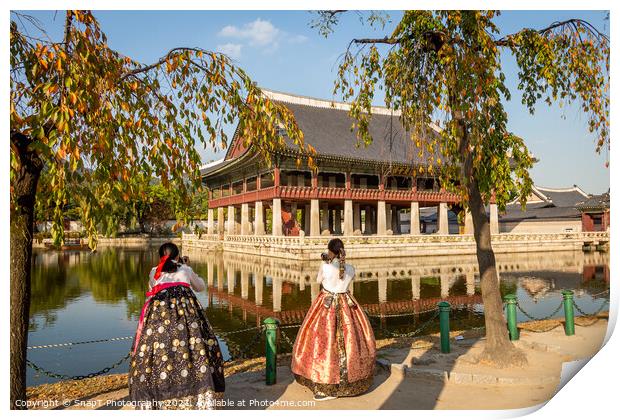 Women dressed in hanbok traditional dresses by the lake at Gyeongbokgung Palace Print by SnapT Photography