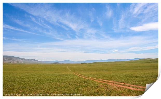 A track across a Mongolian grassland with mountains in the background Print by SnapT Photography