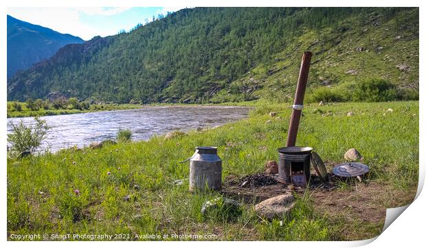 A traditional Mongolian camp cooker and chimney, beside a river Print by SnapT Photography