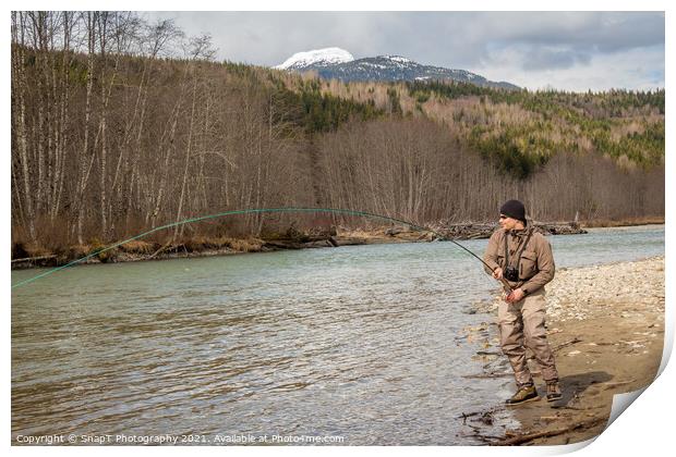 A fly fisherman hooked into a big fish in a river  Print by SnapT Photography