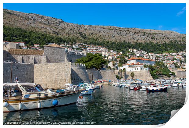 Boats moored in Dubrovnik Harbour by the city walls of the old town, Croatia Print by SnapT Photography