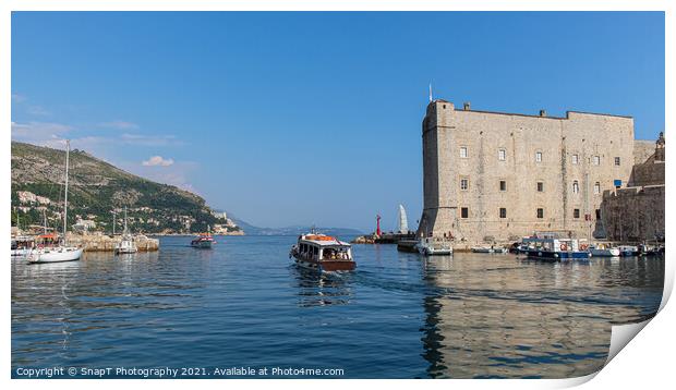 A boat leaving Dubrovnik harbour by the maritime museum in the old town, Croatia Print by SnapT Photography