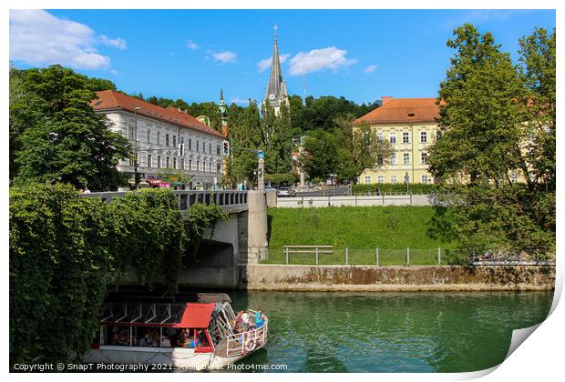 A tourist boat passing under the St. James Bridge on the Ljublijanica River Print by SnapT Photography