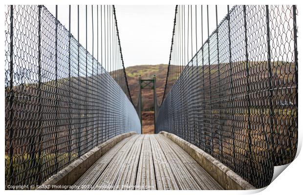 View across a wooden suspension bridge in the Scottish highlands Print by SnapT Photography