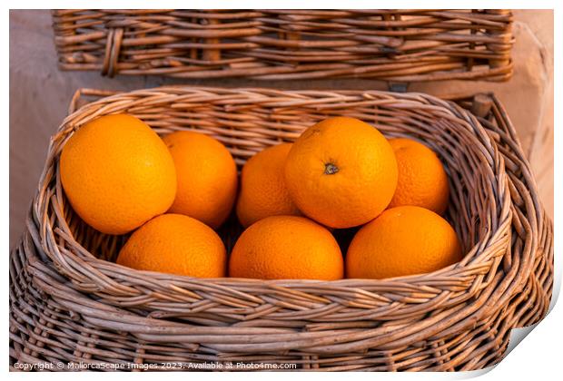 Fresh oranges in a wicker basket Print by MallorcaScape Images