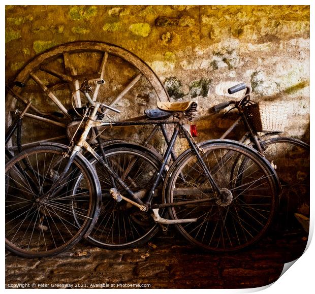 Old Pedal Cycles Propped Up Against A Barn Wall Print by Peter Greenway