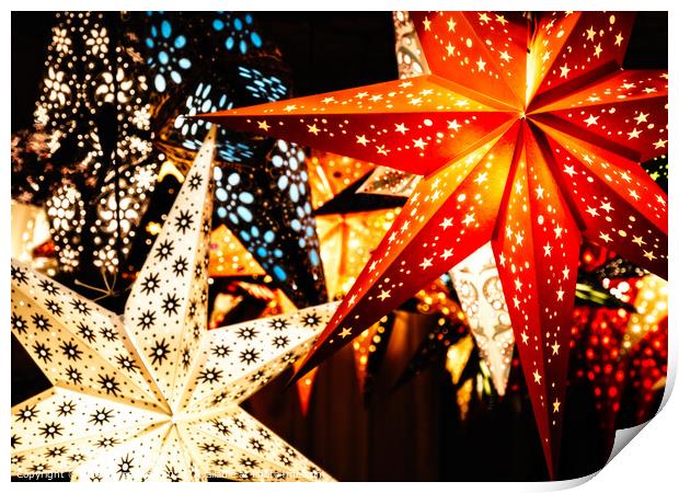 Colourful Illuminated Christmas Star Decorations Print by Peter Greenway