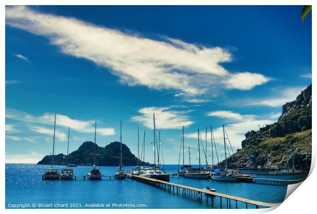 Bay with boats on a jetty Print by Stuart Chard