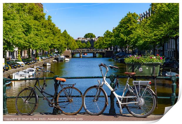 Bikes on the bridge that crosses the canal in Amsterdam, Netherlands Print by Chun Ju Wu
