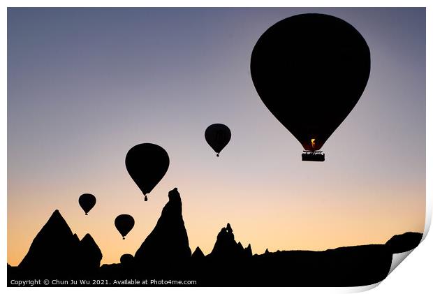 Silhouette of flying hot air balloons and rock landscape at sunrise time in Goreme, Cappadocia, Turkey Print by Chun Ju Wu