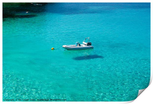 Boat floating on crystal clear water Print by Nic Croad