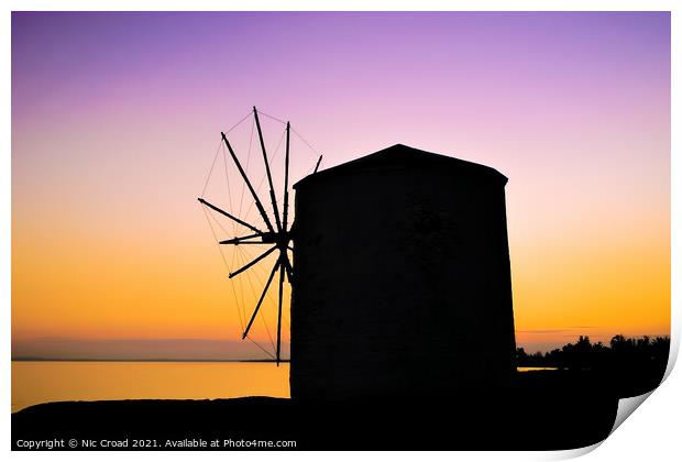 Silhouette of a Greek windmill at sunset Print by Nic Croad