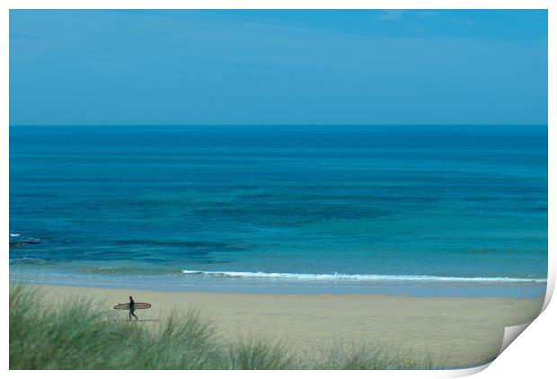 A lone surfer leaving the beach at Constantine Bay, Cornwall Print by Frank Farrell