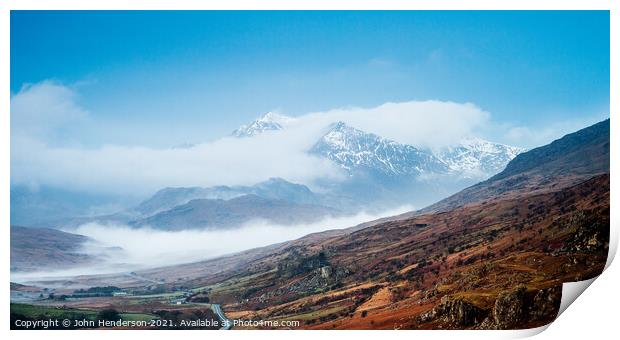 Snowdon emerges from the clouds. Print by John Henderson