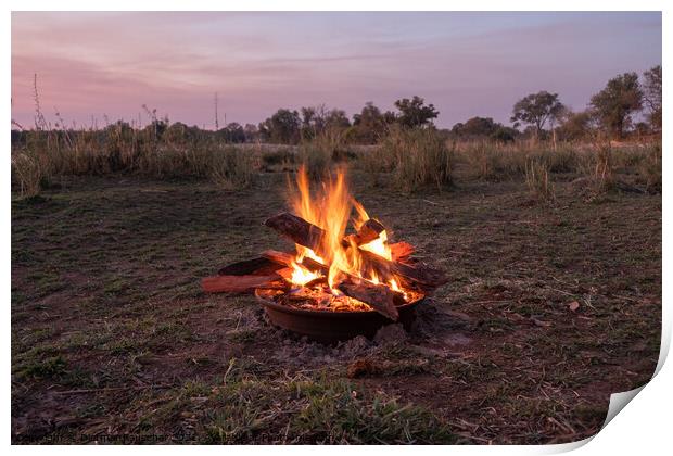 Blazing Camp Fire in Nature at the Okawango, Africa Print by Dietmar Rauscher