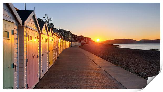 Beach huts at sunrise in Lyme Regis Print by Love Lyme Regis