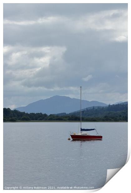Little red sail boat moored on Loch Insh Print by Antony Robinson