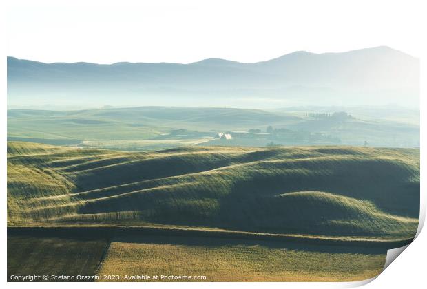 Foggy morning in Tuscany. Rolling hills at sunrise. Val d'Orcia Print by Stefano Orazzini