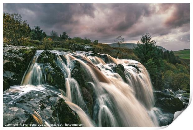 A large waterfall at Sunset Print by Ivor Bond