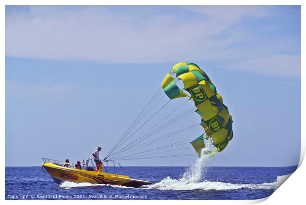 Parasailing boat Print by Raymond Evans