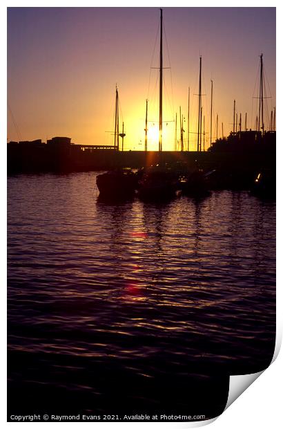 Sunset sailing boats  Print by Raymond Evans