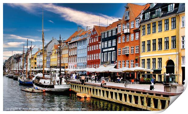 Nyhavn Copenhagen colourful houses with cafes and people alongside canal with boats. Print by Ann Mechan