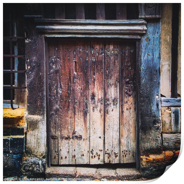 Ancient weathered wooden doorway Print by Chris Rose