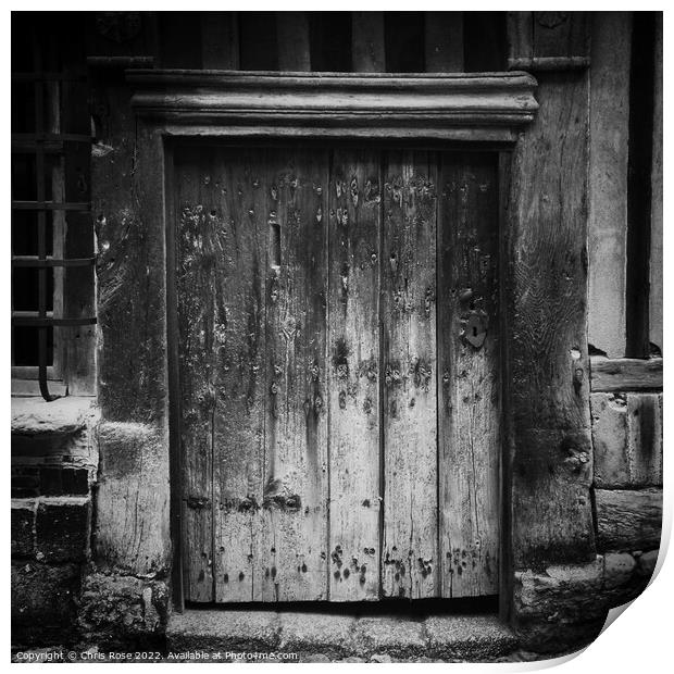 Weathered wooden door Print by Chris Rose