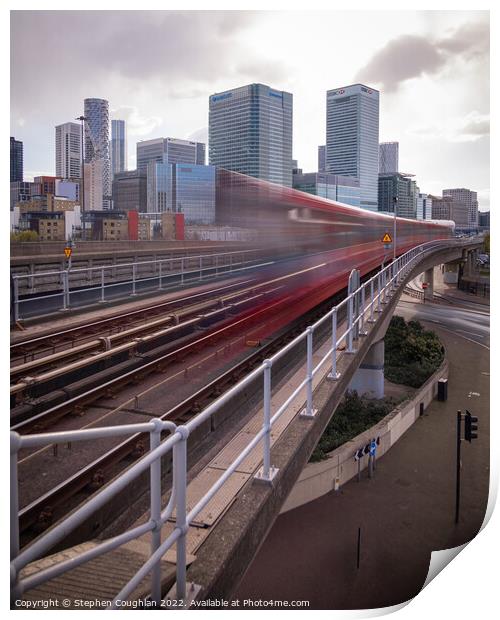 DLR arriving in front of Canary Wharf Print by Stephen Coughlan