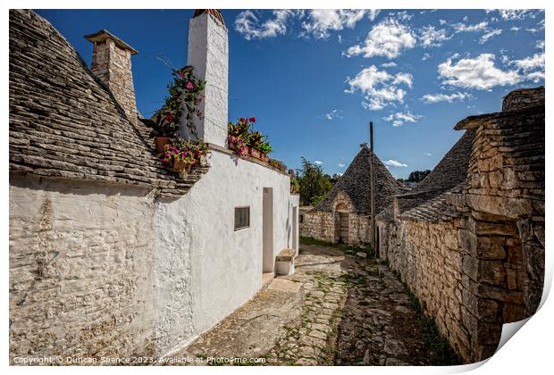 Trulli Houses Print by Duncan Spence