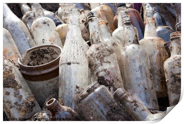 A selection of old glass bottles excavated from a building site in Surrey Print by Gordon Dixon