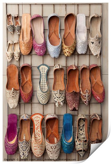 Arabian slippers for sale at a Dubai souk Print by Gordon Dixon