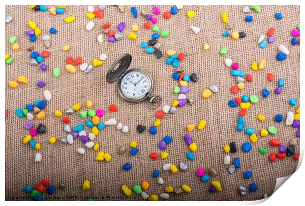 Pocket watch amid Colorful pebbles  Print by Turgay Koca