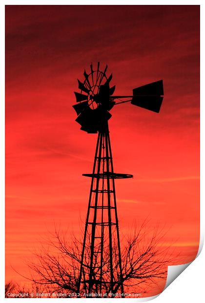 Kansas Sunset with a red Sky and Windmill silhouet Print by Robert Brozek